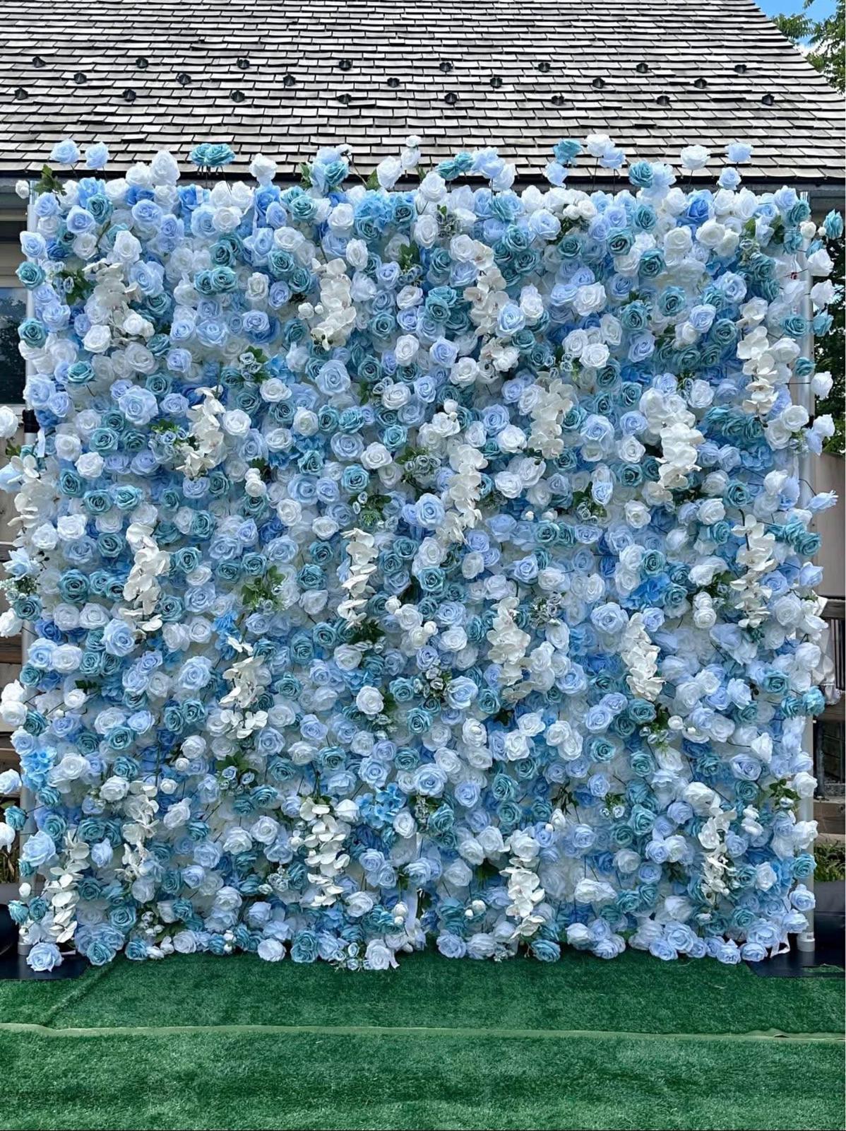 Blue Serenity flower wall — soft baby blue and white roses with cool-toned orchids in a garden setting