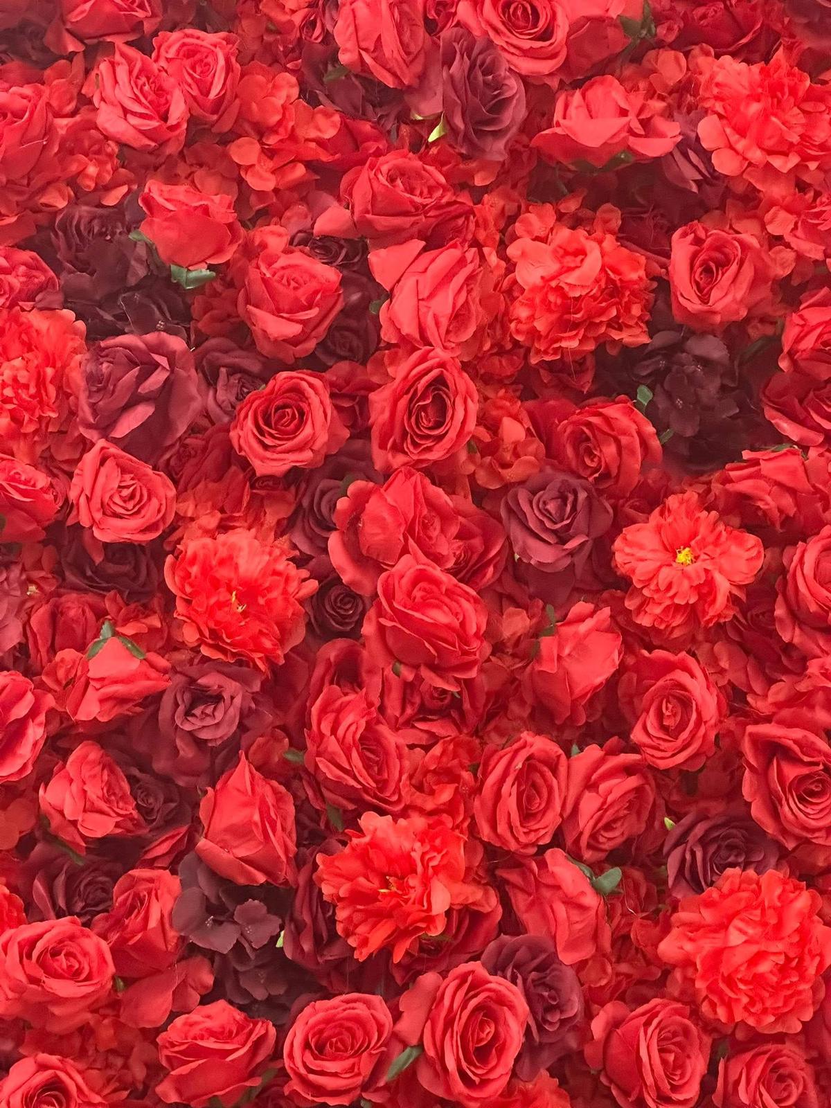 Red Passion flower wall — close-up detail of deep red roses and peonies