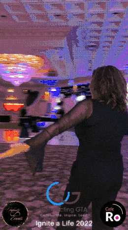 Guest spinning on the 360 booth platform in a decorated banquet hall