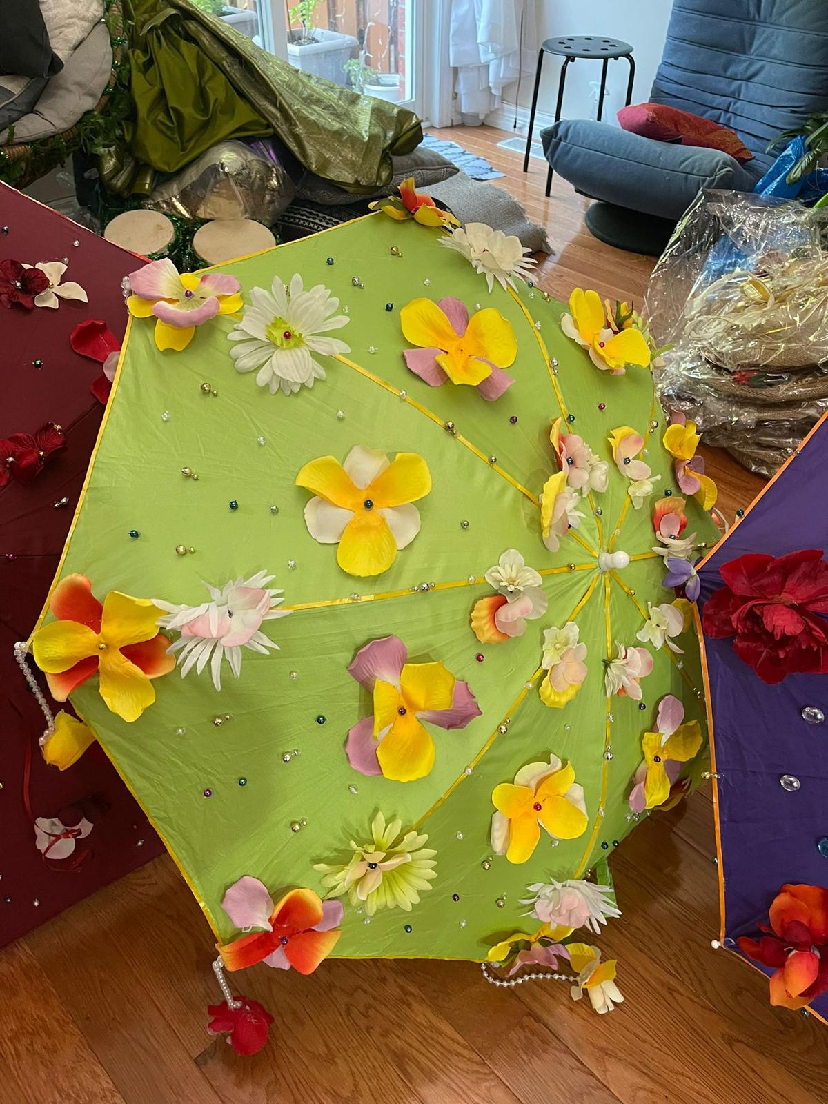 Lime green floral umbrella with yellow and orange flowers