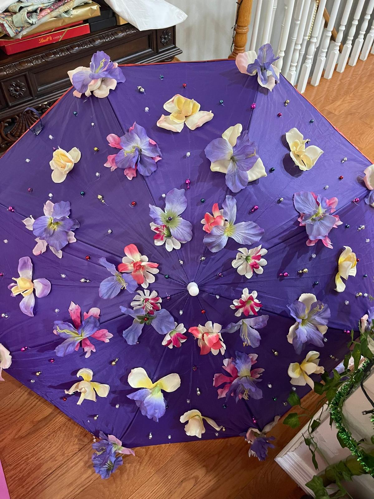 Purple floral umbrella with violet and cream flowers